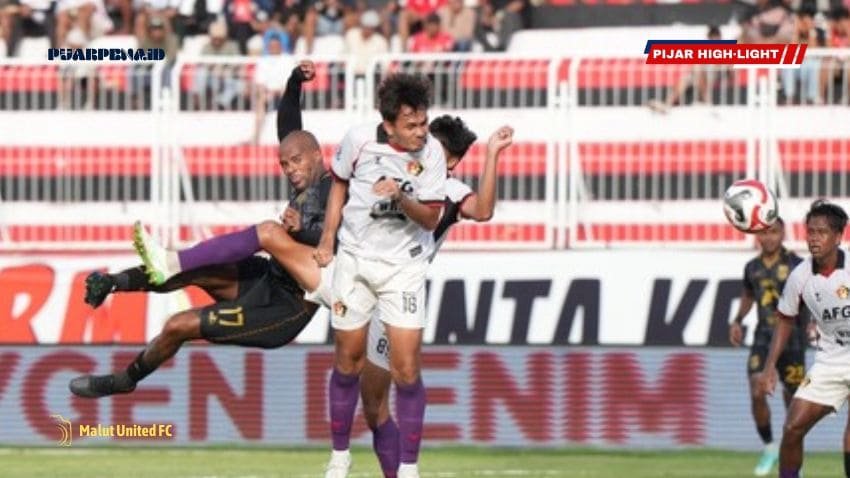 Pemain sepak bola sedang beraksi.